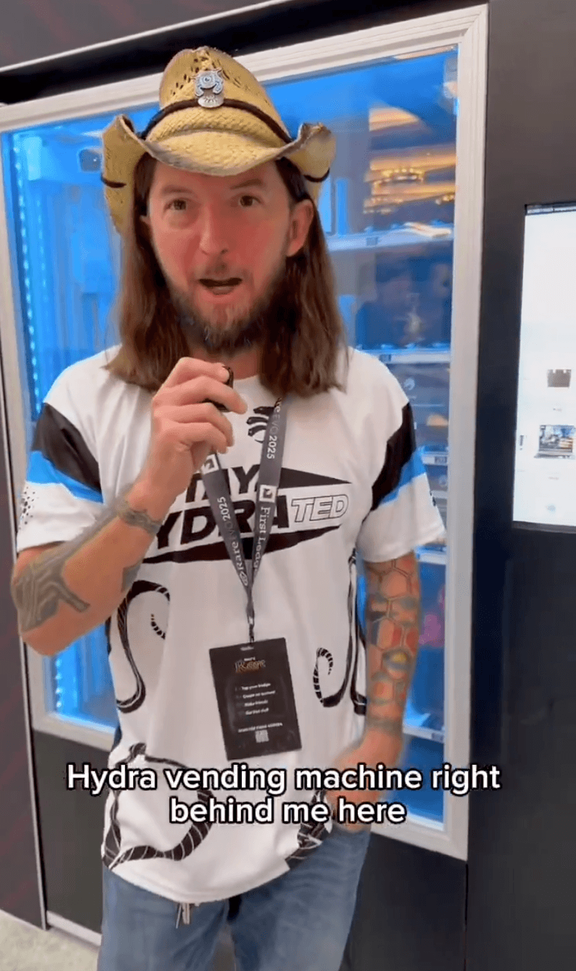 Conference attendees using QR codes to interact with Cardano vending machine